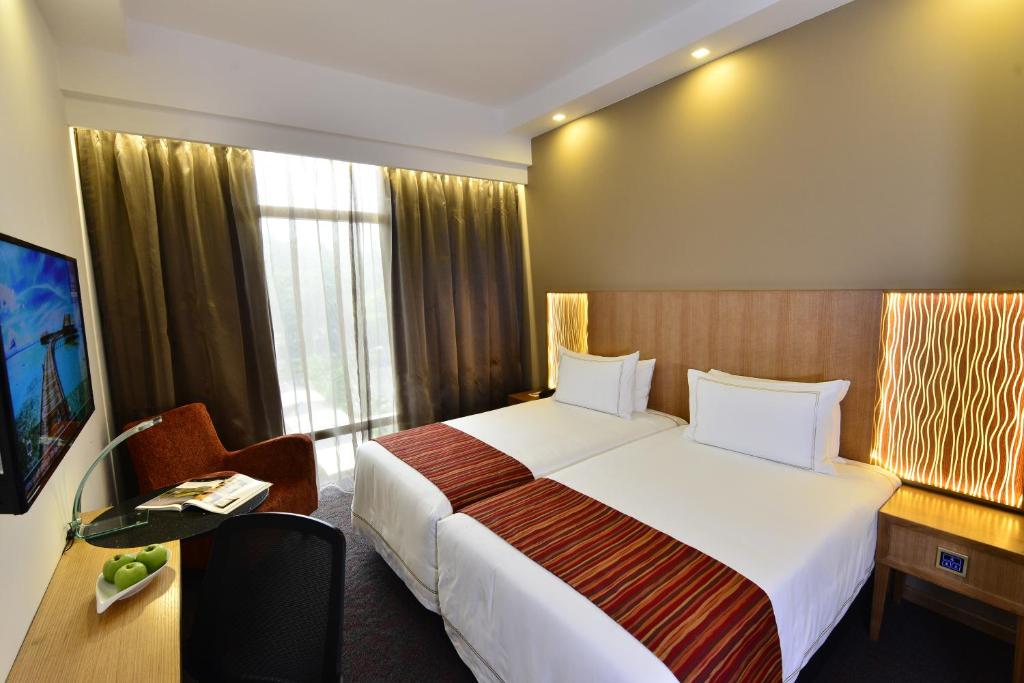 Двухместный (Двухместный номер Делюкс с 1 кроватью или 2 отдельными кроватями) отеля Hotel Grand Central, Сингапур (город)