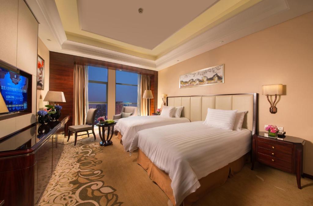 Двухместный (Улучшенный двухместный номер с 2 отдельными кроватями) отеля Grand New Century Hotel Hangzhou Sumtime, Ханчжоу