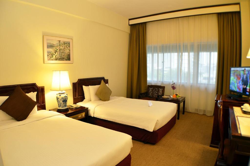 Двухместный (Двухместный номер Делюкс с 2 отдельными кроватями) отеля Hotel Grand Pacific, Сингапур (город)