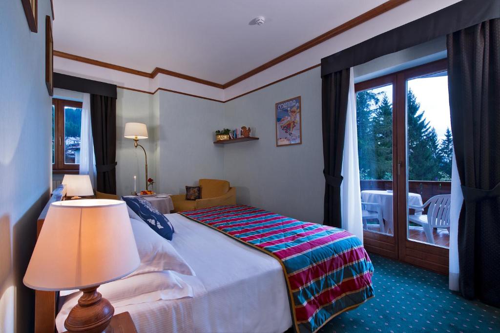 Двухместный (Двухместный номер с 1 кроватью, террасой и видом на горы) отеля Boutique Hotel Villa Blu Cortina, Кортина-д'Ампеццо