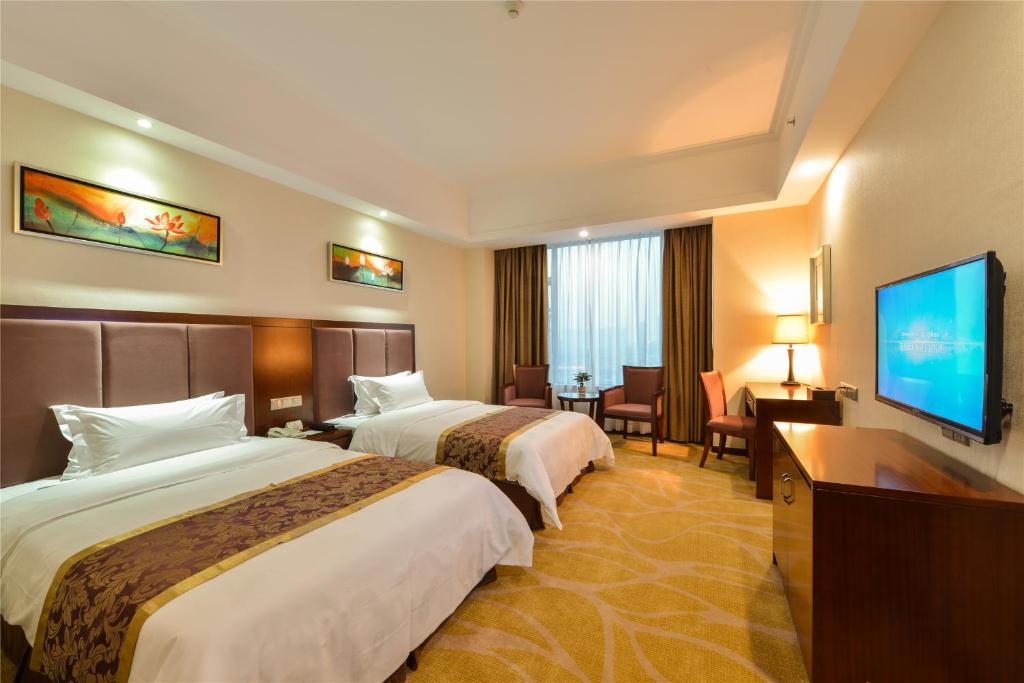 Двухместный (Улучшенный двухместный номер с 2 отдельными кроватями) отеля Foshan Jiagao Business Hotel, Фошань