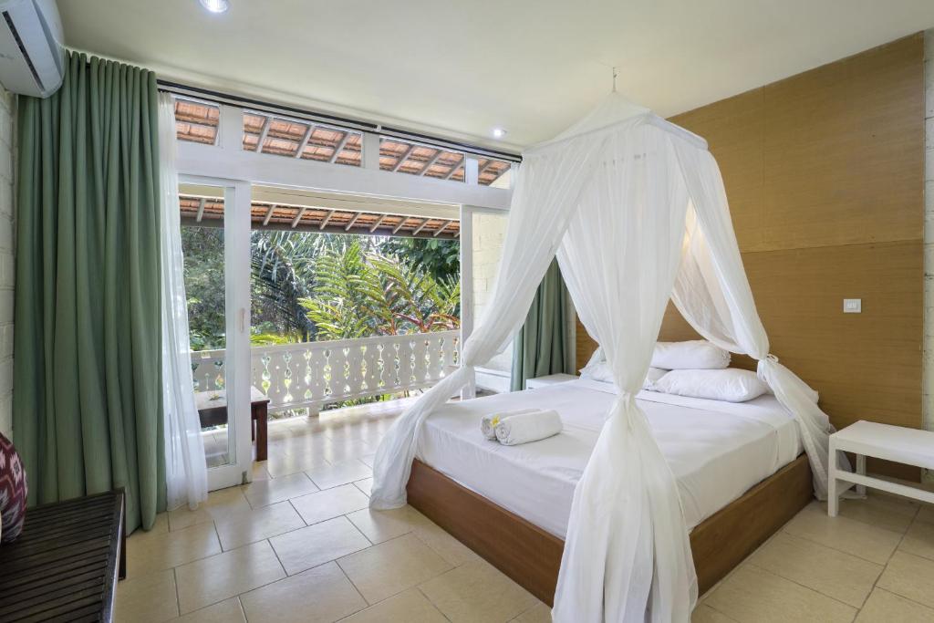 Двухместный (Двухместный номер Делюкс с 1 кроватью, видом на сад и бесплатными преимуществами) курортного отеля Ubud Sari Health Resort, Убуд