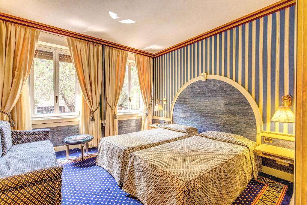 Двухместный (Улучшенный двухместный номер с 1 кроватью или 2 отдельными кроватями) отеля Hotel Auriga, Милан