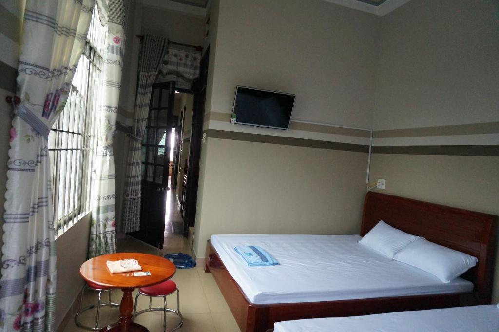 Двухместный (Двухместный номер с 2 двуспальными кроватями) гостевого дома Thanh Lich Guesthouse, Куангнгай