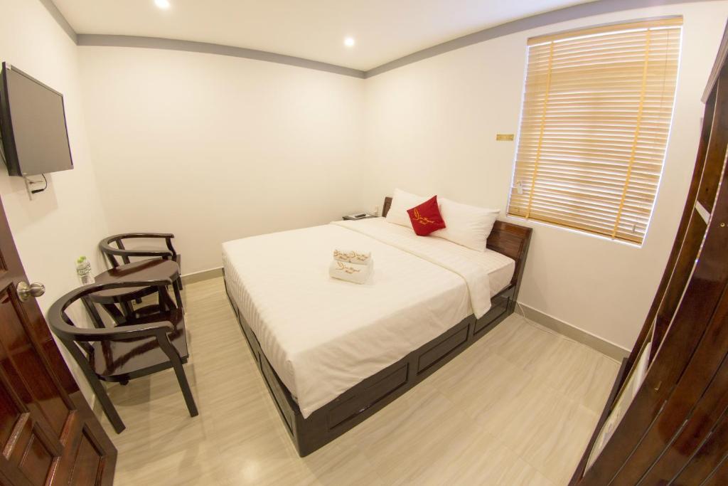 Двухместный (Улучшенный номер с кроватью размера «king-size») гостевого дома Yen Huynh Guest House, Дуонг-Донг