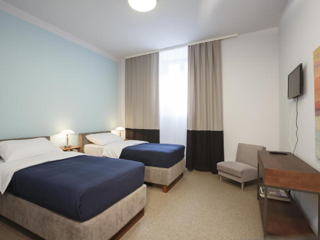 Двухместный (Улучшенный двухместный номер с 1 кроватью или 2 отдельными кроватями) отеля Savamala Bed and Breakfast, Белград
