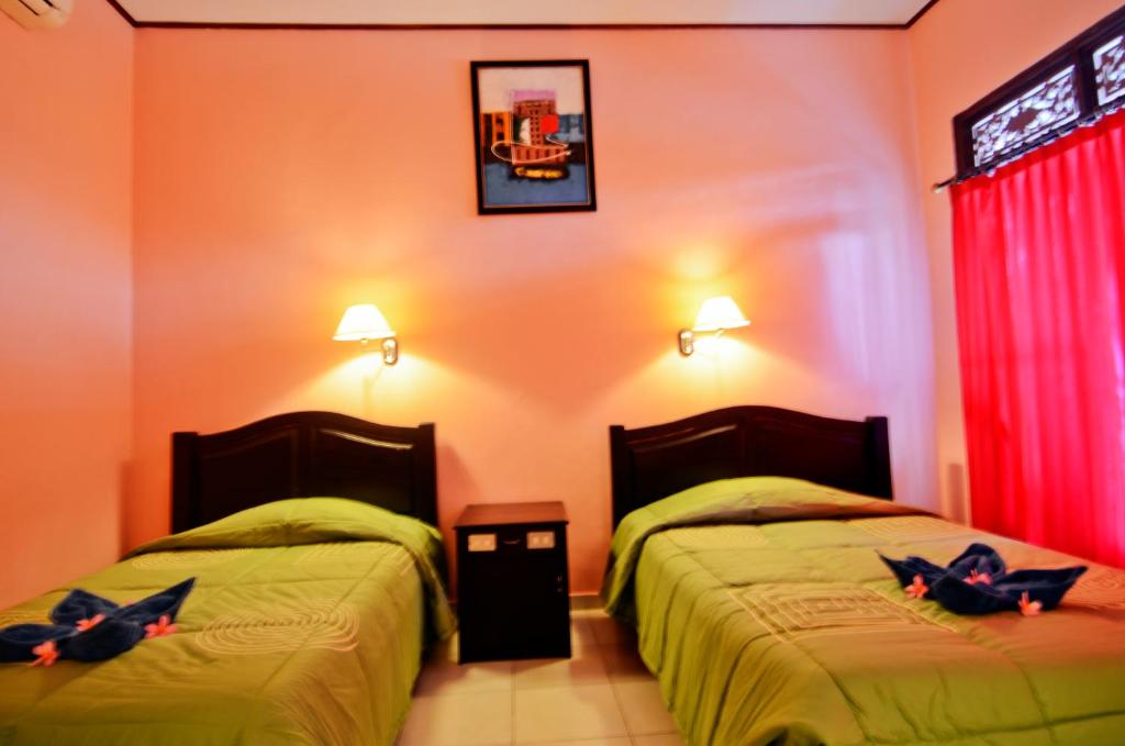 Двухместный (Стандартный двухместный номер с 1 кроватью или 2 отдельными кроватями (только проживание)) отеля Pesona Beach Inn, Кута