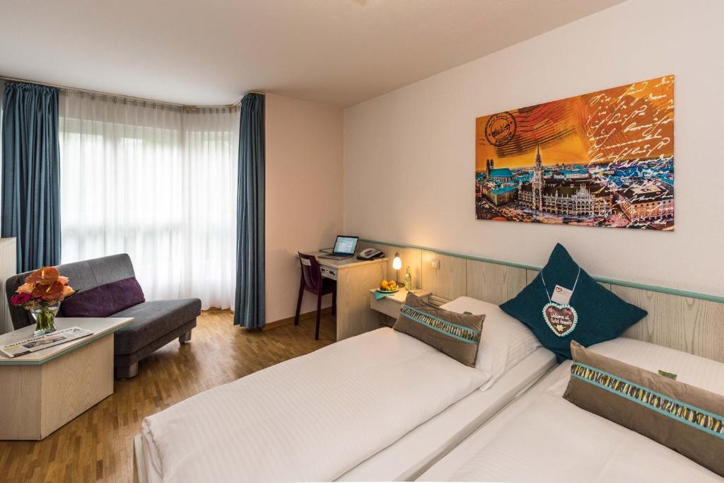 Двухместный (Улучшенный двухместный номер с 2 отдельными кроватями и видом на сад) отеля Hotel Amenity, Мюнхен