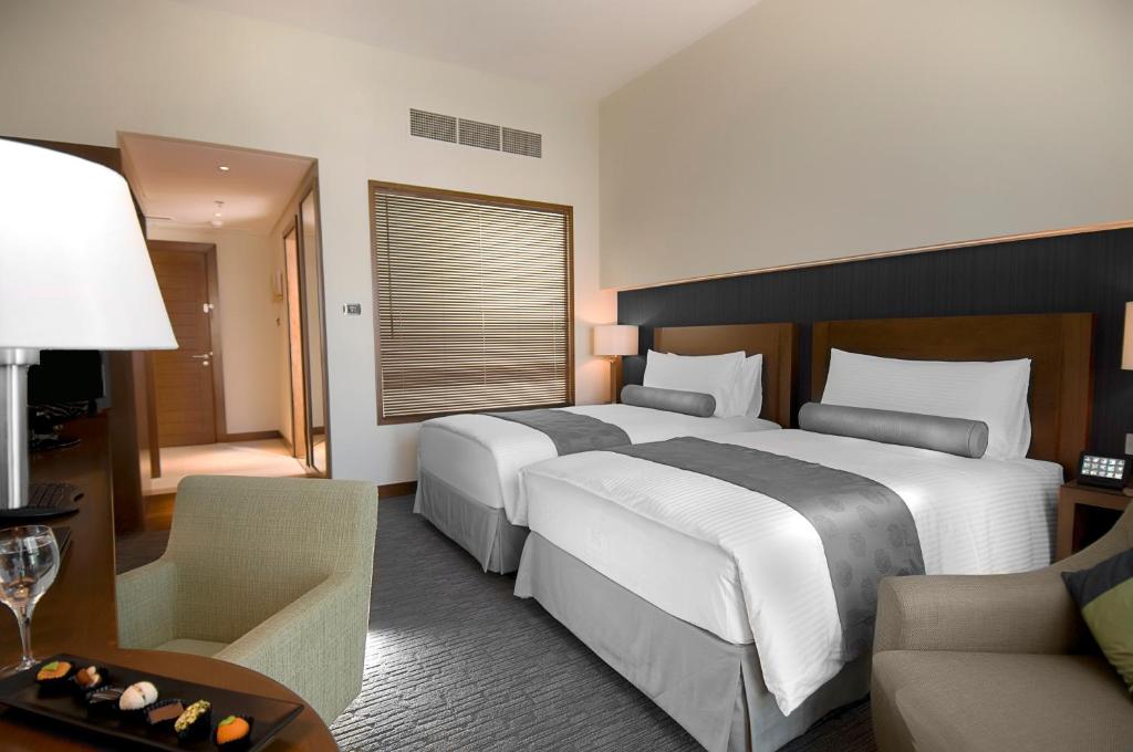 Двухместный (Двухместный номер Делюкс с 2 отдельными кроватями) отеля Grand Millennium Al Wahda Abu Dhabi, Абу-Даби