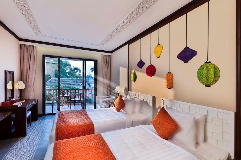 Двухместный (Двухместный номер Делюкс с 1 кроватью или 2 отдельными кроватями) отеля Cozy Hoian Villas Boutique Hotel, Хойан