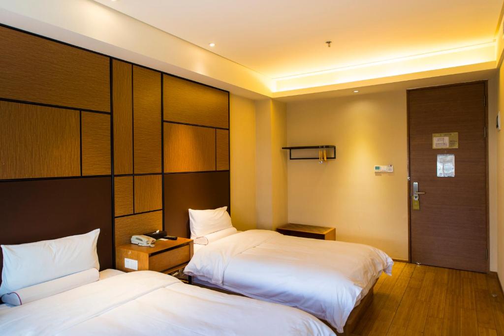 Двухместный (Для граждан материкового Китая - Двухместный номер «А» с 2 отдельными кроватями) отеля JI Hotel Shanghai Tiantong Road, Шанхай