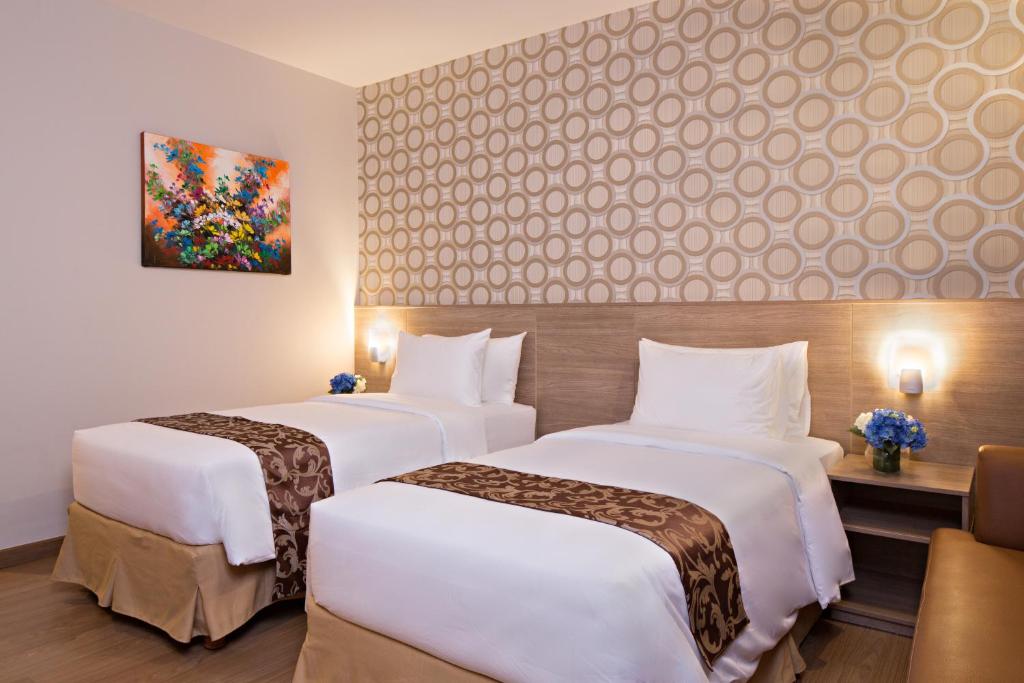 Двухместный (Двухместный номер «Гранд» Делюкс с 2 отдельными кроватями) отеля Ayaka Suites, Джакарта