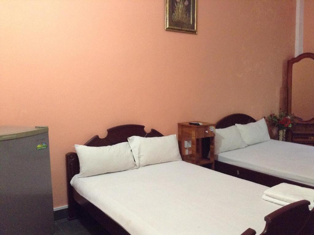 Двухместный (Стандартный двухместный номер с 2 двуспальными кроватями) отеля Sunshine Hotel & Hall, Тринкомали