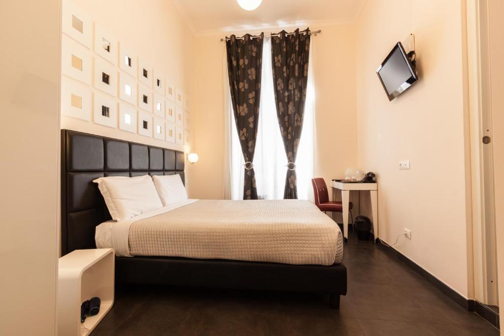 Двухместный (Небольшой двухместный номер с 1 кроватью или 2 отдельными кроватями) отеля Deko Rome, Рим