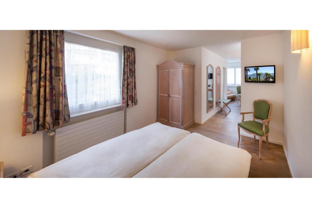Двухместный (Бюджетный двухместный номер с 1 кроватью или 2 отдельными кроватями) отеля Hotel Stella, Локарно