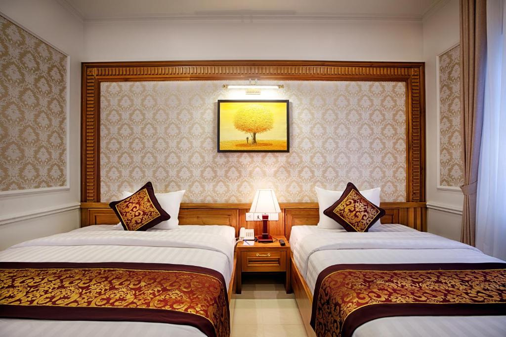 Двухместный (Двухместный номер Делюкс с 2 отдельными кроватями и видом на реку) отеля Riverside Hotel - Quang Binh, Донгхой