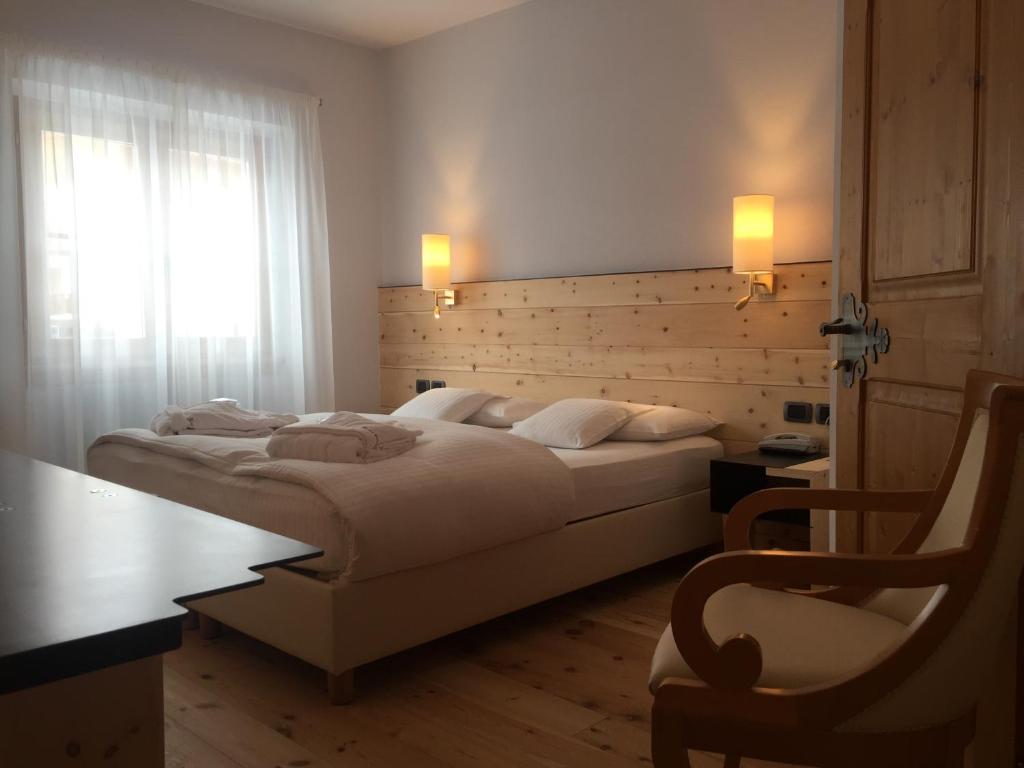 Двухместный (Стандартный двухместный номер с 1 кроватью или 2 отдельными кроватями) отеля Chalet Laura Lodge Hotel, Мадонна-ди-Кампильо