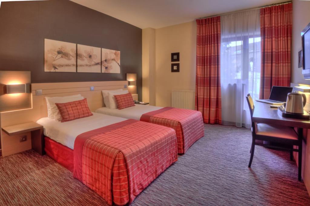 Двухместный (Классический двухместный номер с 2 отдельными кроватями) отеля Hotel Lido **** Mons Centre, Монс