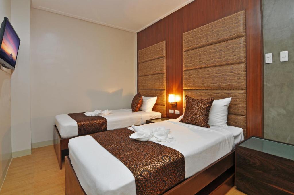 Двухместный (Двухместный номер Делюкс с 2 отдельными кроватями) отеля 717 Cesar Place Hotel, Панглао