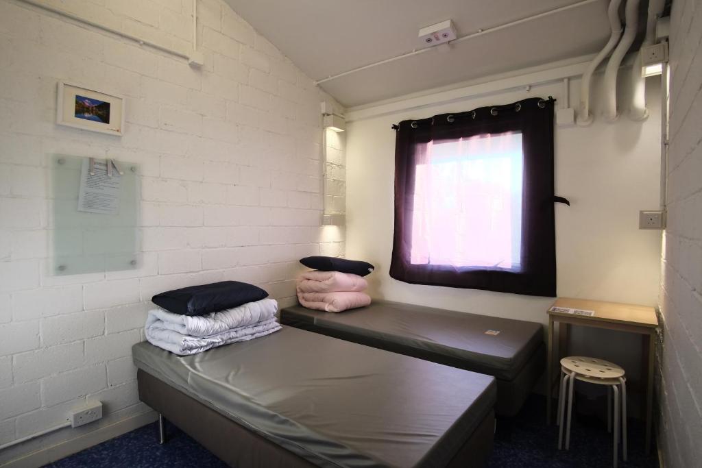 Двухместный (Двухместный номер с 1 кроватью или 2 отдельными кроватями и видом на море) хостела YHA Jockey Club Mt. Davis Youth Hostel, Гонконг (город)