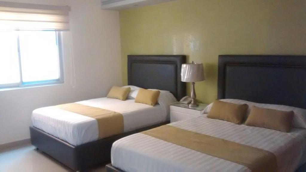 Двухместный (Двухместный номер с 2 отдельными кроватями) отеля Hotel Tierra Roja, Арандас