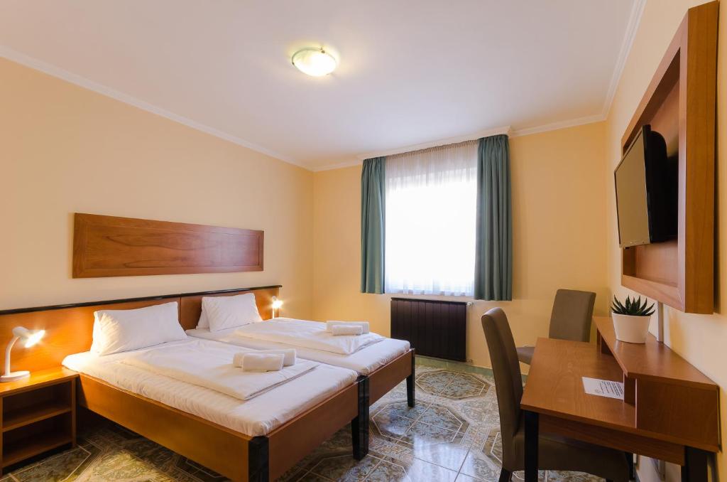 Двухместный (Улучшенный двухместный номер с 1 кроватью или 2 отдельными кроватями) отеля Hotel Richter, Будапешт