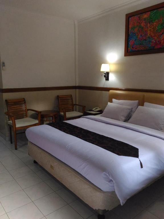 Двухместный (Двухместный номер Делюкс с 1 кроватью или 2 отдельными кроватями для 1 человека) отеля Hotel Sorga Cottages, Кута