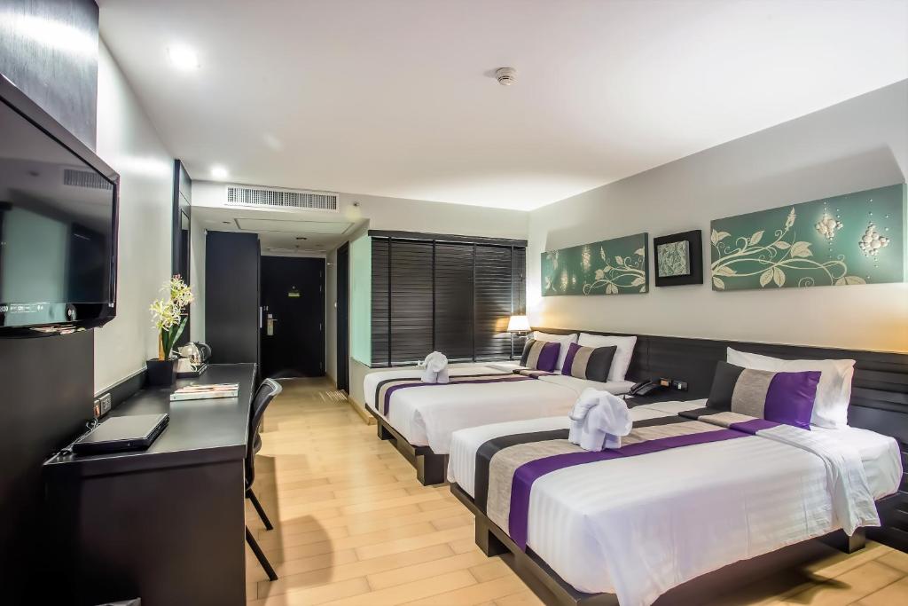 Двухместный (Двухместный номер «Гранд» Делюкс с 2 отдельными кроватями) отеля Nouvo City, Бангкок