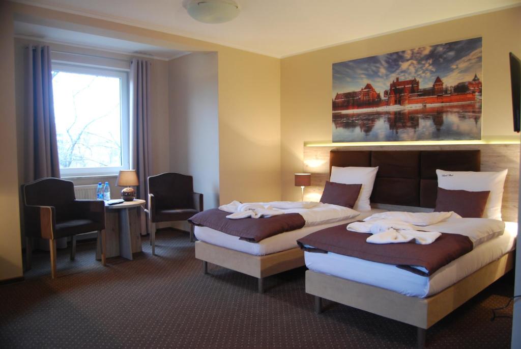Двухместный (Двухместный номер Делюкс с 1 кроватью или 2 отдельными кроватями) отеля Hotel Piast, Мальборк