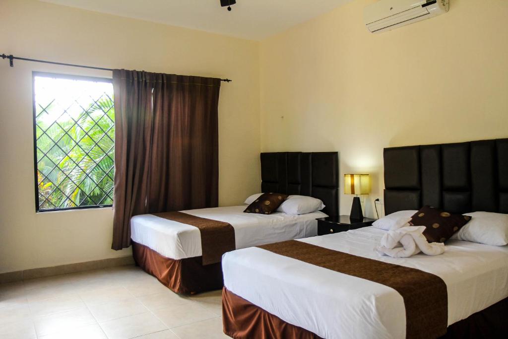 Двухместный (Стандартный двухместный номер с 2 двуспальными кроватями) отеля Hotel Hacienda Izamal, Исамаль