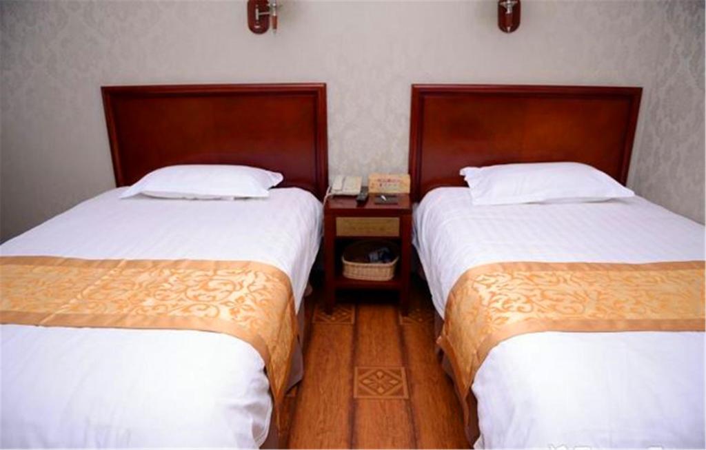 Двухместный (Двухместный номер Делюкс с 2 отдельными кроватями) отеля GreenTree Inn Heilongjiang Harbin Zhongyang Street Business Hotel, Харбин