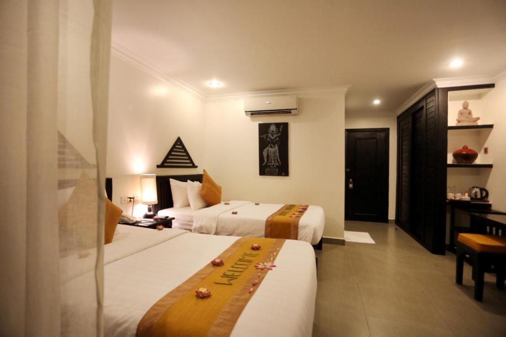 Двухместный (Двухместный номер Апсара с 2 отдельными кроватями и видом на бассейн) отеля Khmer Mansion Boutique Hotel, Сием Рип