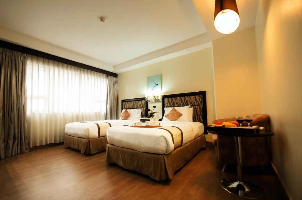 Двухместный (Улучшенный двухместный номер с 2 отдельными кроватями) отеля Diamond Suites and Residences, Себу