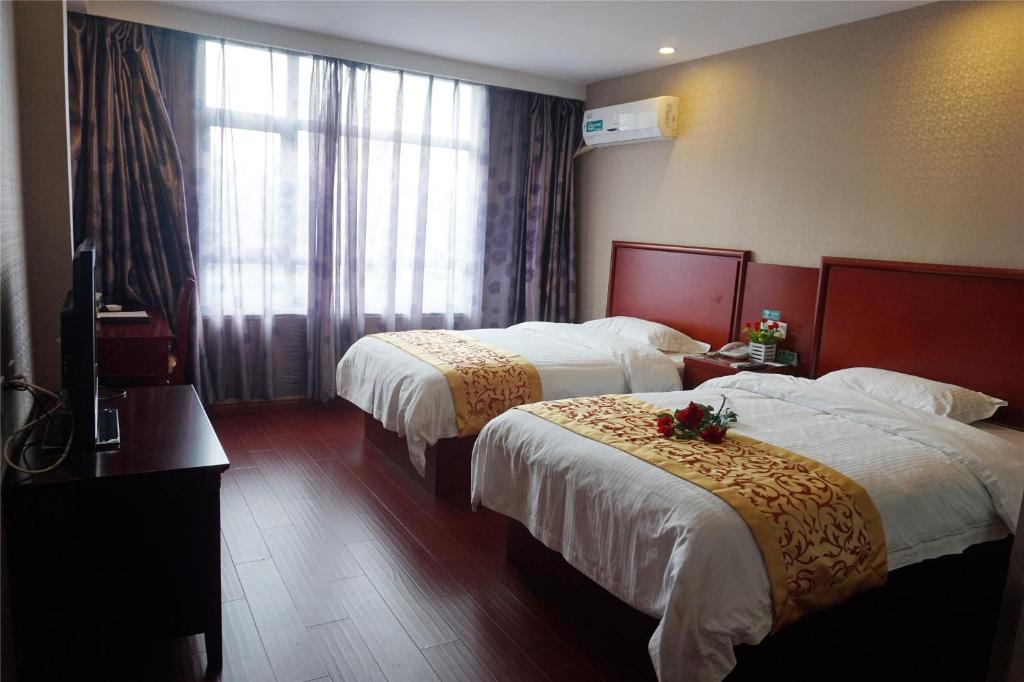 Двухместный (Стандартный двухместный номер с 2 отдельными кроватями) отеля GreenTree Inn JiangSu Hotel, Уси