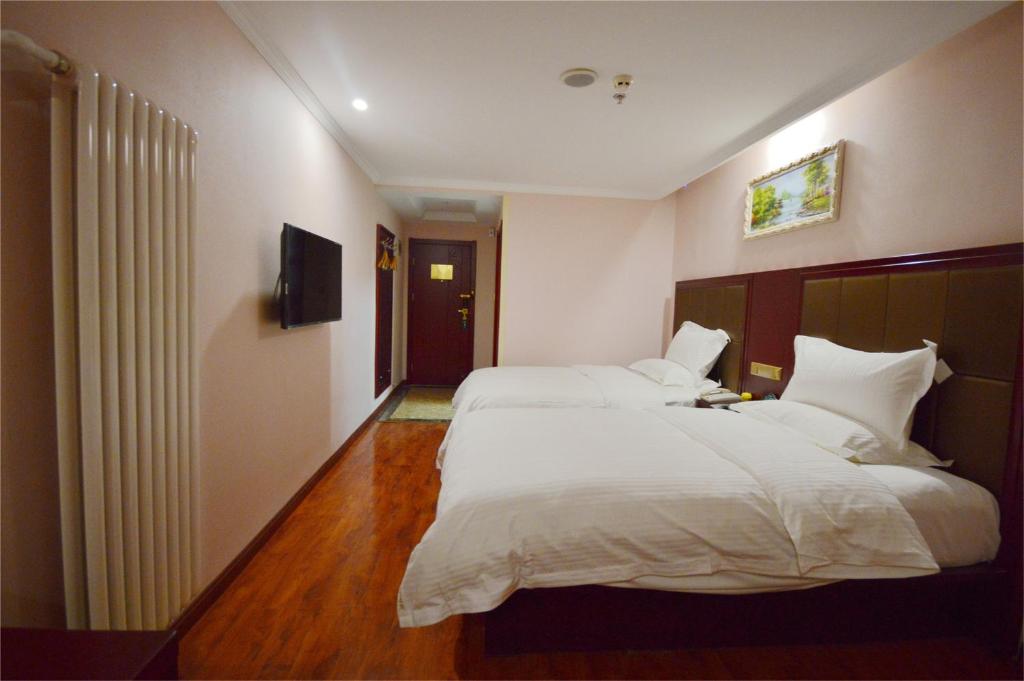 Двухместный (Двухместный номер Делюкс с 2 отдельными кроватями) отеля GreenTree Inn Hainan Haikou Guomao Business Hotel, Хайкоу