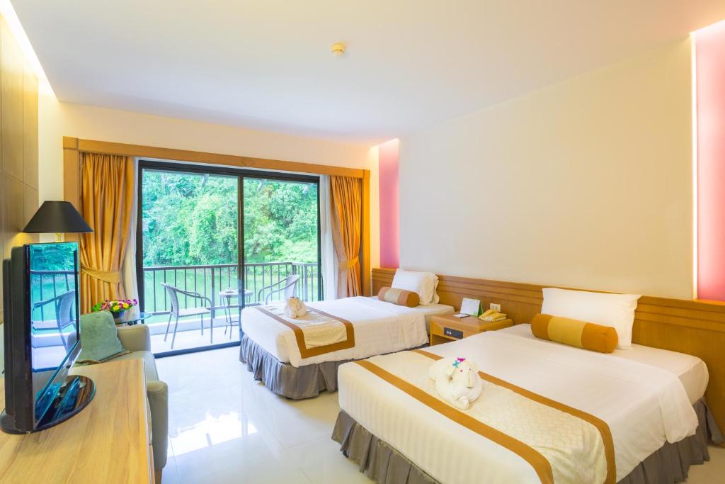 Двухместный (Улучшенный двухместный номер с 1 кроватью или 2 отдельными кроватями) отеля Tinidee Golf Resort at Phuket, Пхукет