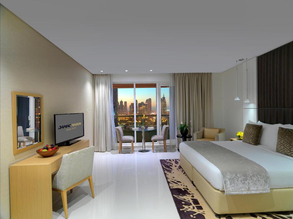 Апартаменты (Люкс с 1 спальней и видом на центр города) апарт-отеля DAMAC Maison Canal Views, Дубай