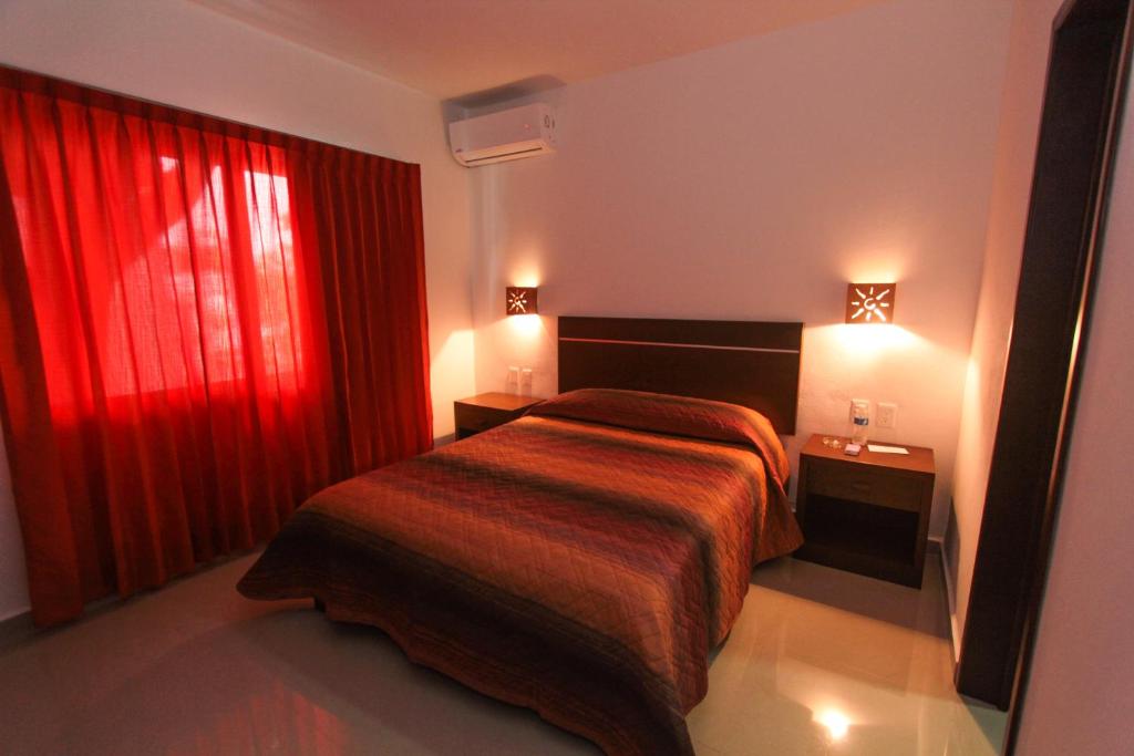 Двухместный (Двухместный номер Делюкс с 1 кроватью) апарт-отеля Hotel Los Girasoles, Канкун