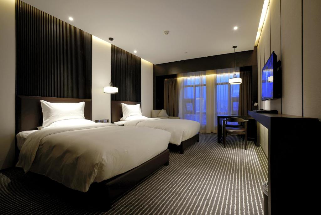 Двухместный (Классический двухместный номер с 2 отдельными кроватями) отеля Eastern House Boutique Hotel, Сиань