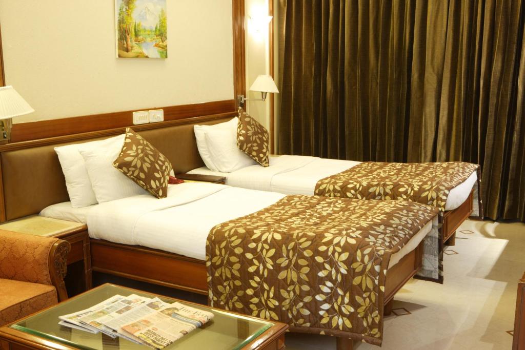Двухместный (Двухместный номер Делюкс с 1 кроватью или 2 отдельными кроватями) отеля Regal Enclave, Мумбай