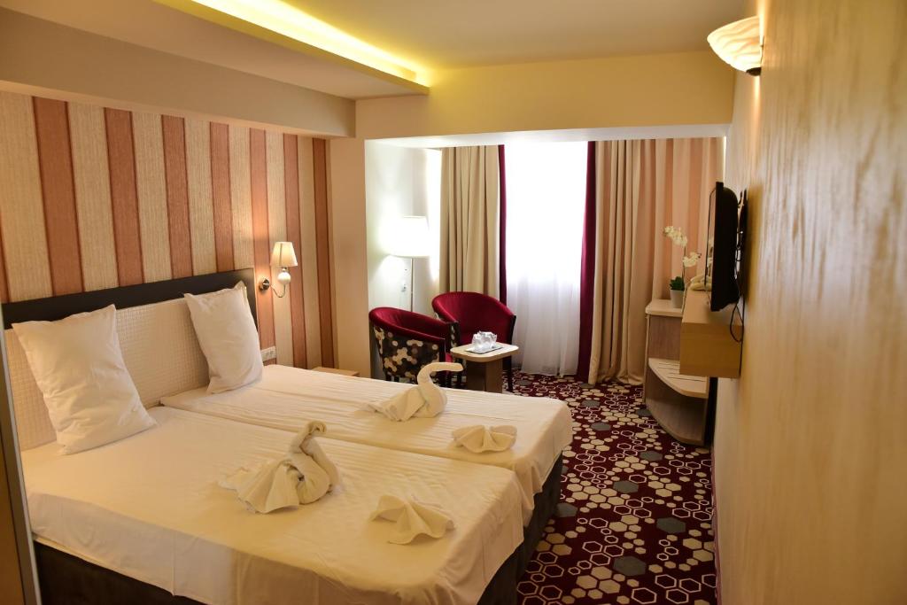 Двухместный (Улучшенный двухместный номер Делюкс с 1 кроватью или 2 отдельными кроватями) отеля Hotel Craiovita, Крайова