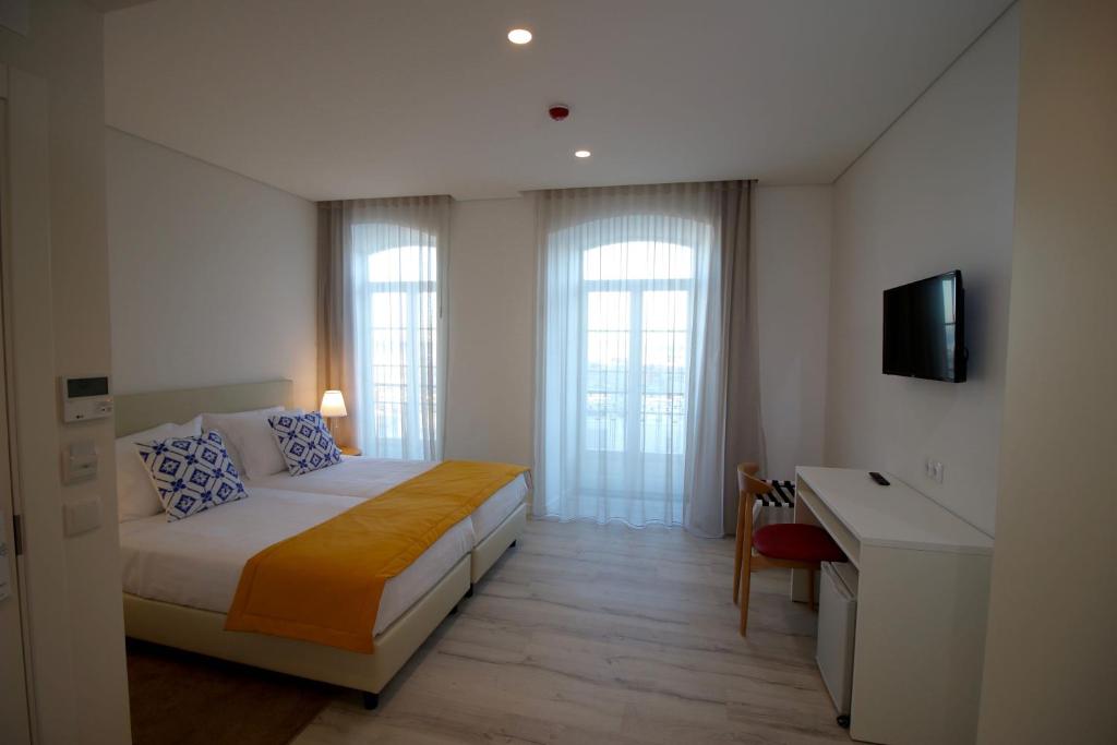 Двухместный (Улучшенный двухместный номер с 1 кроватью или 2 отдельными кроватями) отеля Hotel Riverside Alfama, Лиссабон