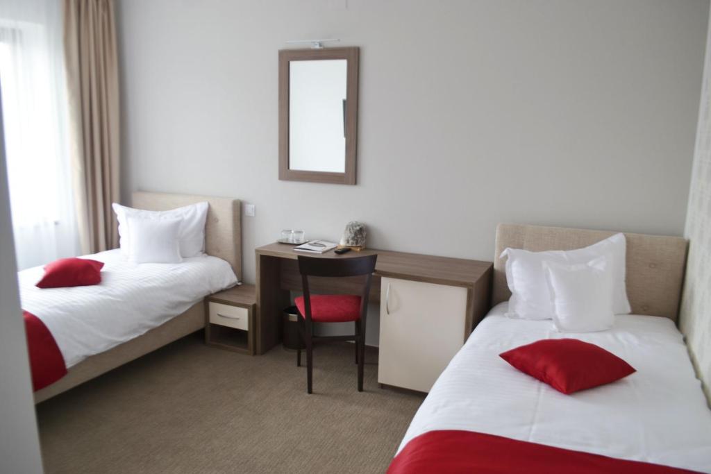 Двухместный (Двухместный номер с 2 отдельными кроватями - Подходит для гостей с ограниченными физическими возможностями) отеля Potaissa Hotel, Турда