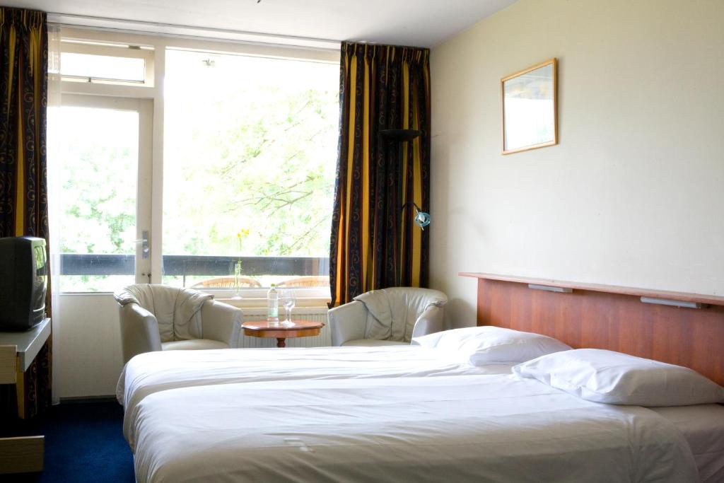 Двухместный (Стандартный двухместный номер с 1 кроватью и балконом) отеля Fletcher Hotel Restaurant Bon Repos, Маастрихт