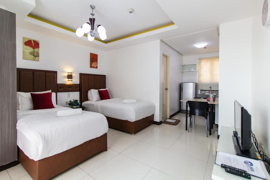 Двухместный (Представительский номер с 2 односпальными кроватями) апарт-отеля JMM Apartment Suites, Манила