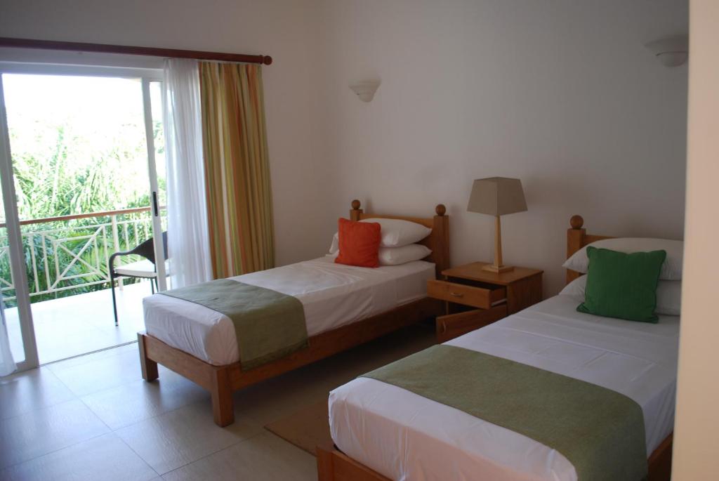 Двухместный (Двухместный номер с 2 односпальными кроватями, завтрак включен) отеля Marie Laure Suites, Бель-Омбр (Индийский океан)