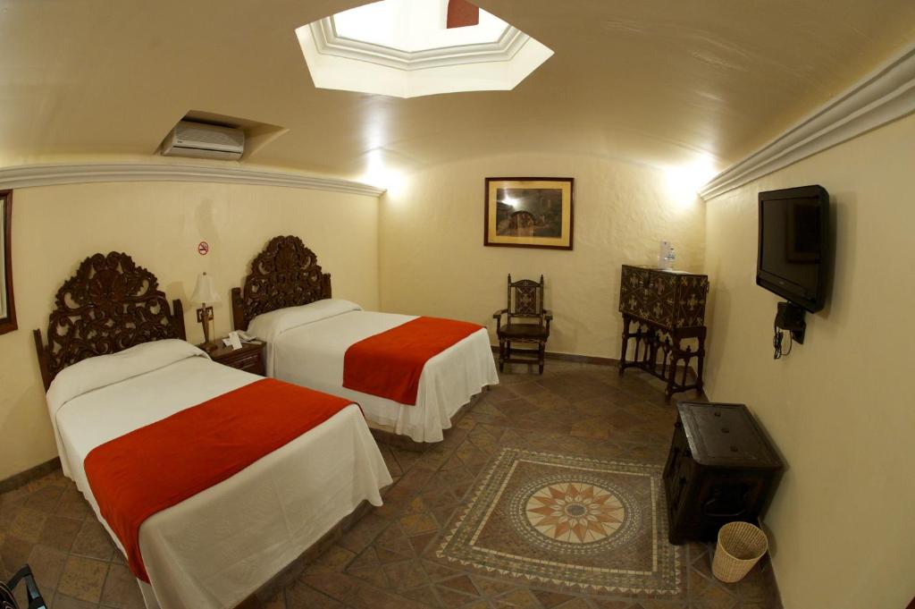 Двухместный (Номер Делюкс) отеля Hotel Hacienda Vista Hermosa, Текескитенго