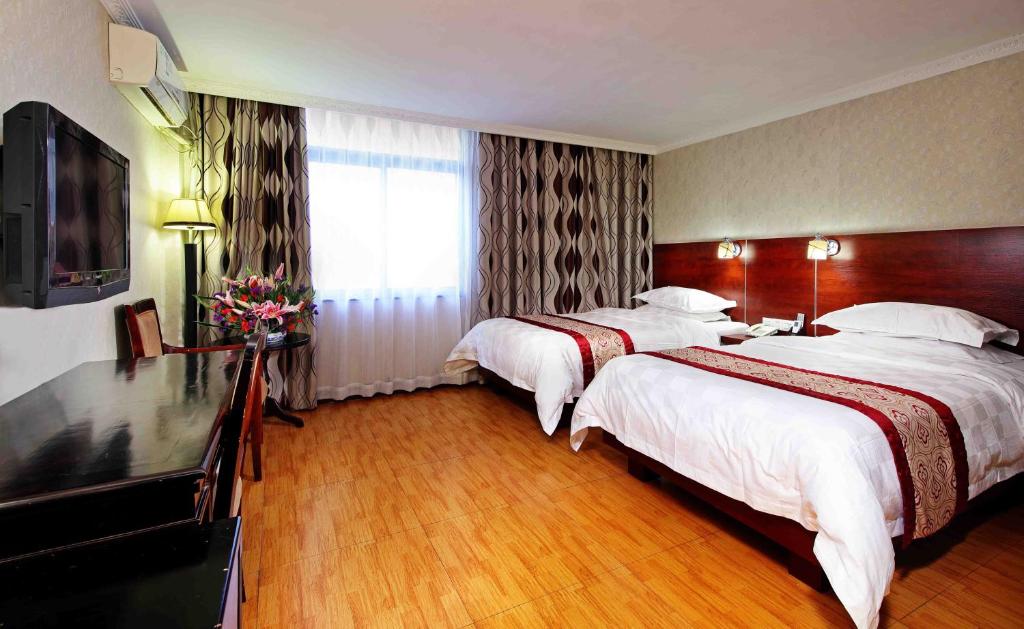 Двухместный (Двухместный номер Делюкс бизнес-класса с 2 отдельными кроватями) отеля Guang Dong Hotel, Гуанчжоу