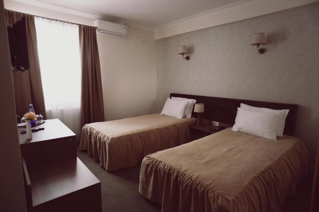 Двухместный (Стандартный двухместный номер с 2 отдельными кроватями) отеля C&C Residence Hotel, Бакэу