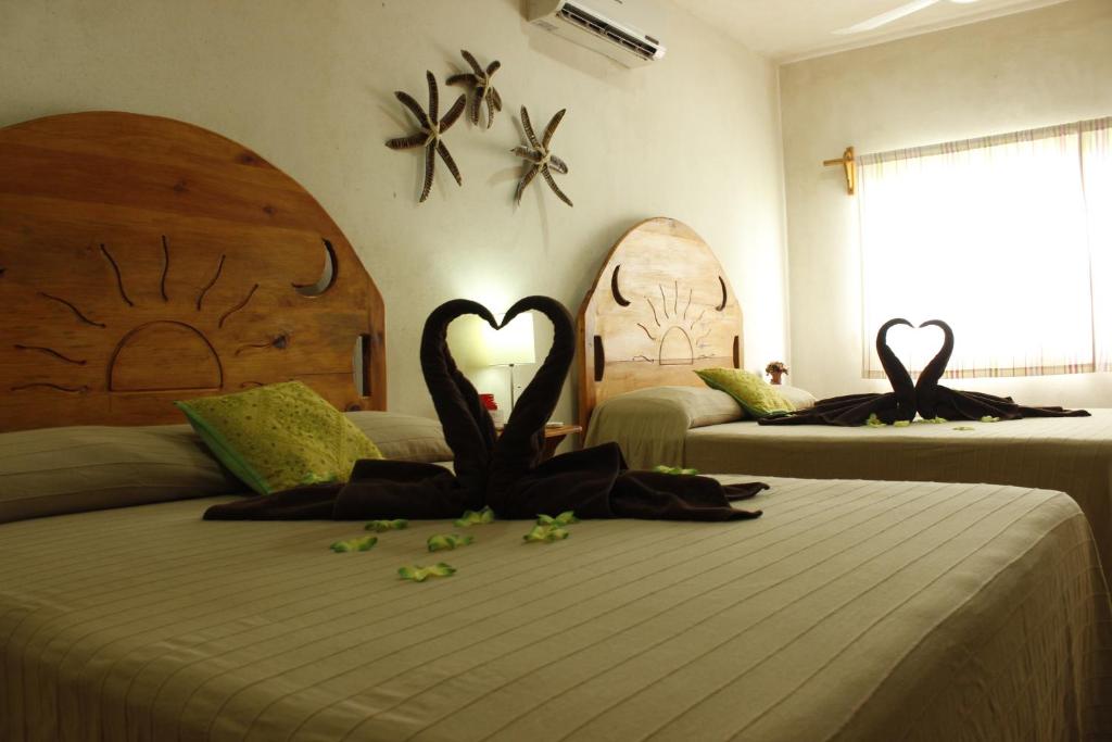 Четырехместный (Четырехместный номер Делюкс) отеля Maya Vacanze Playa Natural, Плая-дель-Кармен